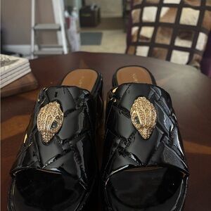 Kurt Geiger Glossy Black Mules with Gold Accents
